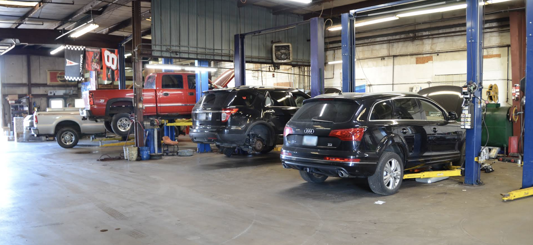 Service bay with vehicles on lifts